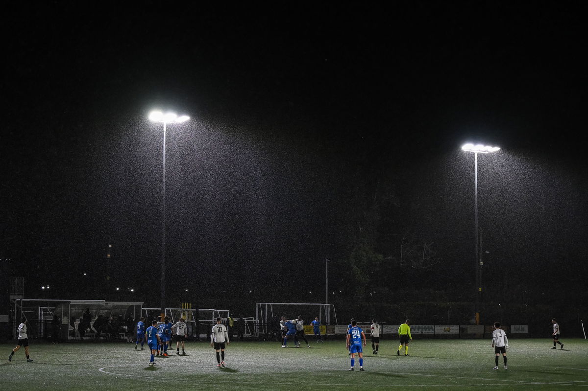 The game was played in wet and windy conditions at Maes Tegid